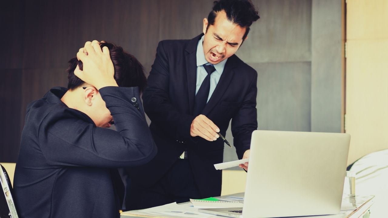 An employer berating an employee